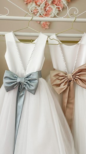 Meet the Charlotte dress – just one of our stunning Crystal and Pearl flower girl dresses. 🌸✨ Customize it with a spectrum of colors to perfectly complement your wedding theme. Let your flower girl shine in a dress as unique as your special day. 💐👗 #WeddingElegance #FlowerGirlStyle | Crystal and Pearl Boutique