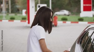 Gas Station Gas Pump Close Up Pump Nozzles At Gas Station Young Beautiful Woman Driver Fills The Car With Gasoline