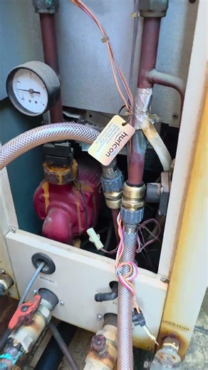 Power flushing the hydronic heating system to remove sludge, debris and restore flow