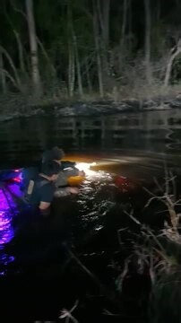 This group of friends was night riding at their local ATV park and had stopped by the river for drinks when an ATV suddenly sped into the water. Everyone was shocked as the driver held his breath underwater, while his friends’ waders filled with icy water. | Jukin Copyright Management