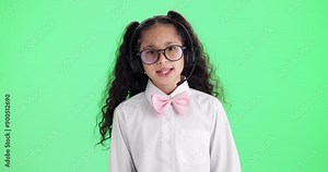 Girl, child and call center in green screen with talk, glasses and headphones with voip mic by studio background. Kid, consultant or agent with games, funny or learning with telemarketing in portrait