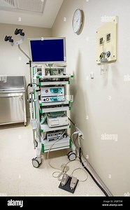Modern endoscopy equipment kit. Electronic video Endoscopy System. A patients couch and a stand with a gastroscope and a monitor Stock Photo - Alamy
