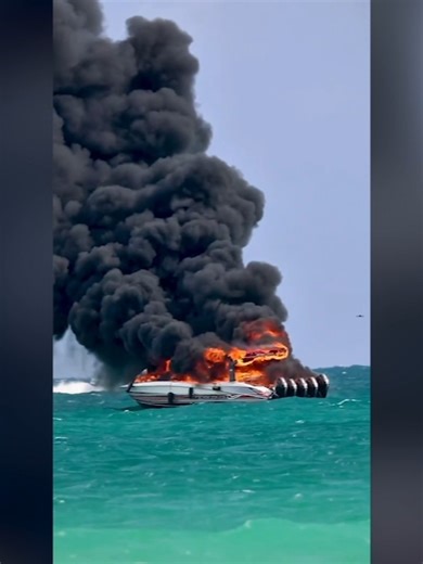 A group of tourists from Nebraska were on a 40-foot boat off of Miami Beach, Florida, when it caught fire. A local photographer captured video of thick black smoke pouring from the boat on Thursday. #news #miamibeach #florida #boatfire