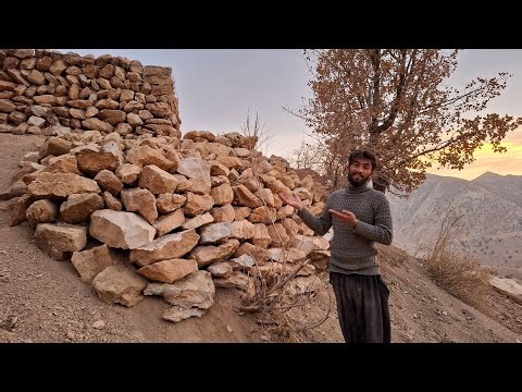 Ali's Effort: Ali carrying stones to build the foundation of the hut