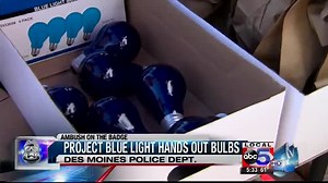 Project blue light hands out bulbs