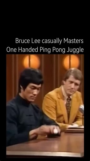 reels.Xworld on Instagram: "The post features a 15-second clip from Bruce Lee's 1971 interview on The Pierre Berton Show, where he juggles a table tennis ball one-handed while seated, showcasing his extraordinary dexterity. This authentic footage, rediscovered and shared without caption, has amassed over 2 million views in under 24 hours, with replies split between admiration for Lee's skills and suspicions of Al generation due to its fluid realism. The viral debate underscores how advancements 