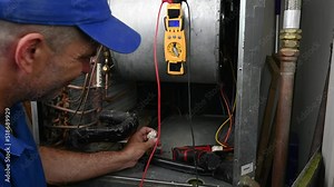 HVAC Technician Checking Voltage on a Blower Motor