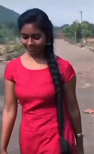 Walking through Nature in a Stylish Red Dress