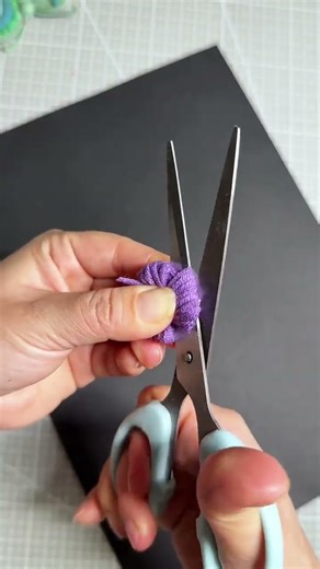 Who would have thought? A fork can be used to make yarn balls! #ParentChildCrafts