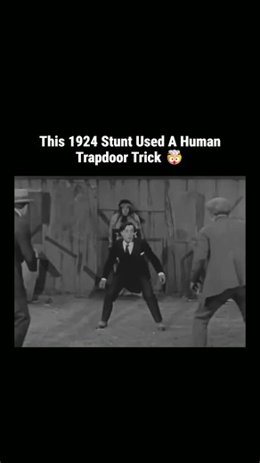 Explaining 🔥 on Instagram: "It looks like a camera trick or old-school editing, but it’s a masterpiece of practical engineering and physics. The trick is simple geometry, not video overlay. The assistant isn’t standing — they’re lying horizontally on a hidden support beam behind the fence. The upper body is visible above the cut, but the rest is suspended backward and there’s a big physical gap in the middle. To complete the illusion they used a weighted fabric front that looked like a dress bu