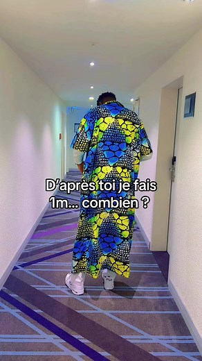 Vibrant Robe Fashion Poses in Modern Corridor