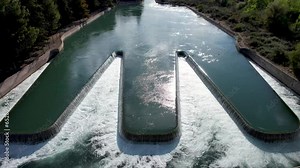 Aerial video of silt and clay sedimentation basin in an agricultural irrigation canal.