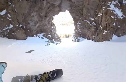 Mammoth Snowboarder Rides Through Natural Lava Tube Formation