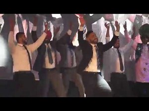 Men in suits ALMOST break the stage with Bhangra Dance