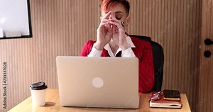 Angry business woman sits at the desk works from home at the laptop burst in rage, businesswoman working at the computer feels furious stressed, having problems at work.