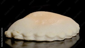 Timelapse - shortcrust flat cake, pastry pie with cottage cheese baking and rising on tray in electric oven - black background, close up. Homemade bakery, food, pastry and time lapse concept