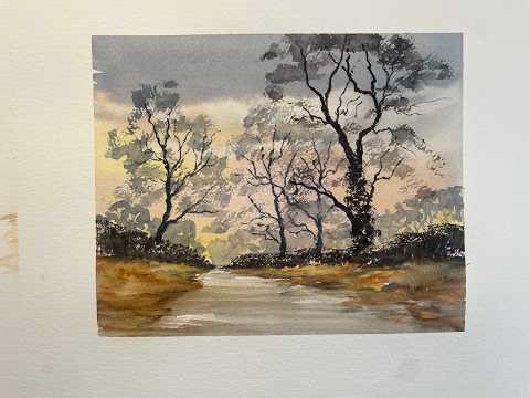 Trees silhouetted against a sunset sky - watercolour step by step.