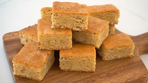 BUTTERSCOTCH Bars that melts in your mouth How to make a chewy and moist Butterscotch bars. Here's what you'll need: 1 and ½ cup brown sugar (300g) 3/4 cup unsalted butter (170g) 2 eggs 3 tbsps corn syrup or glucose (45g) 1 tsp vanilla extract (5ml) 2 cups all purpose flour (250g) 1 tsp baking powder (4g) 1 tsp salt (4g) 1/2 cup coarsely chopped walnuts (60g) 1. Preheat oven at 180°C or 350°F. 2. In a pan, cook together brown sugar and unsalted butter. Keep mixing until the mixture starts to boi