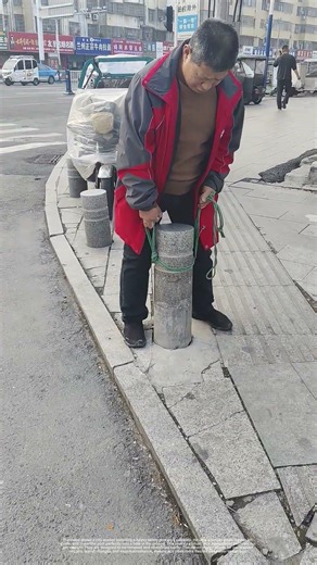 How a City Worker Installs a Sidewalk Safety Post