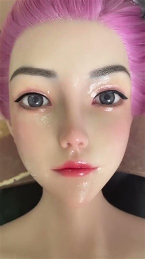 Touching up the makeup of a wax doll beauty