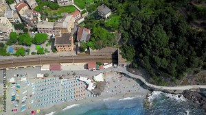 Panorama view of Monterosso al Mare village one of Cinque Terre in La Spezia,Italy.Panoramic drone view of railway, beach,village.View on architecture of old italian village and beautiful bay.Video 4K