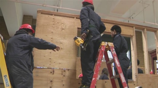 Students building houses inside Bronx school