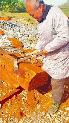 Master Carpenter Shapes a Giant Wooden Beam with Hammer and Adze