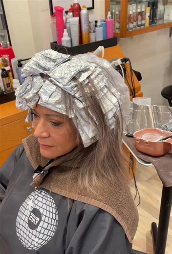 To create this look, I lightened with Matrix Professional Hair Color & Care High Riser Pre-Bonded. I got rid of the remaining yellow tones by pre-toning with So Silver Shampoo. Then I low-lighted with SoColor Sync 6P & 6T for dimension and toned with Tonal Control 8T & 10T. I used K18 Hair K18REPAIR™ throughout the whole process, chelator, mist , leave in mask and the heat protectant molecular repair hair oil. This Transformation was one of the hardest transformations I’ve ever done because the 