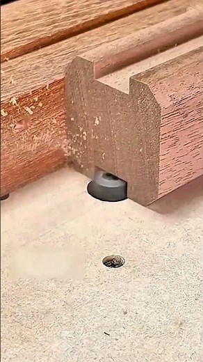 Trimming a board flush to the table surface using a router bit through a guide hole
