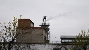 Old factory building outside. Industrial buildings exterior for production of sugar from sugar beets