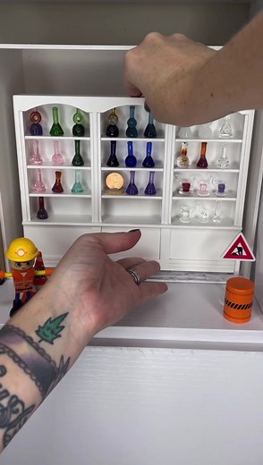 Setting up the original Tiny Treasures, the world’s smallest retail ready glass shop! I’ve almost outgrown this custom made roombox since last November, I’ve been dreaming of a big change for the shop! 😏🤫 #coralstinyworld #miniatures #glassart #artglass | Corals Glass