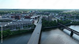 Saint Cloud, Minnesota and Veterans Bridge over Mississippi River. Aerial reveal shot of town.