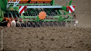Sowing machine works in field. Agricultural machinery. Tractor with seeder. Concept of work in agronomic farm for making business and having profit from production organic food. Farmer seeding grain Stock Video