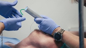 Close-up of an endotracheal tube being inserted into a patient under anesthesia. Concept airway management and patient safety.