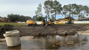 Florida city races to repair flood-damaged neigborhood