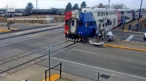 Driver jumps out of SUV moments before train crashes into it
