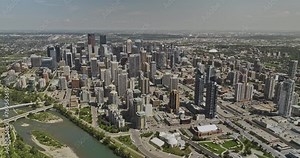 Calgary AB Canada Aerial v6 high altitude drone flyover Bow river, birds eye view capturing entire downtown cityscape with dense skyscrapers on a sunny day - Shot with Mavic 3 Pro Cine - July 2023