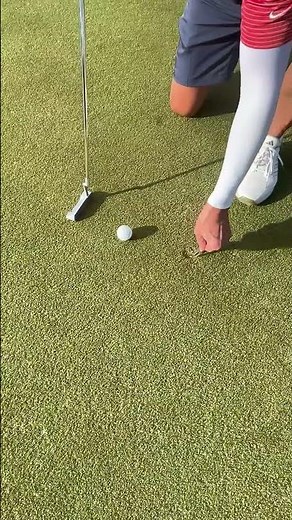Properly fixing ball marks on the green.