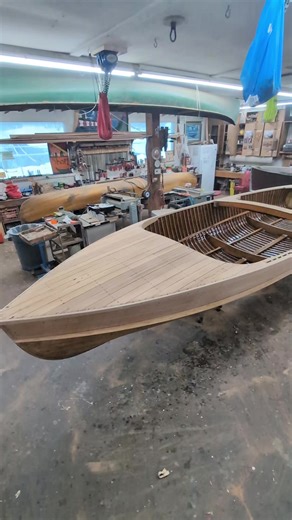 18' Peterborough admiral just about ready for finishing! fiberglass and paint below the splash rail and many coats of varnish on deck and sides.