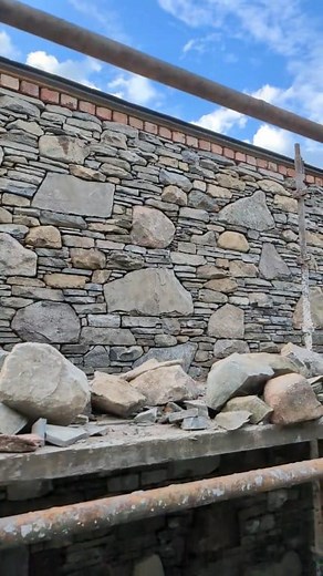 Another big wall finished. Using only traditional tools. Mostly just my hammer and sometimes a chisel for high Lumps. Limestone, grai, sandstone and liscannor Stone supplied by Paddy Carroll Coole Stone @top fans #selfbuildni #tradesmen #buildingstone #architecture #stonemasonry #construction #tradional #tradelife #building #stone #art #ireland #artistsoninstagram | Vintage Stoneworks