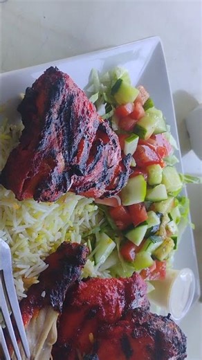 Daood Basha Cuisine Tandoori chicken, with the rice and Salad.