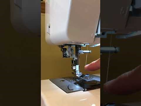 Step 4 of 5: How to thread the needle of a Brother xr3774 sewing machine