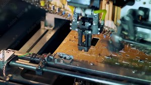 PCB Assembly, A Pick And Place Machine Working On Printed Circuit Board Assembly. Close Up. 4K Resolution.