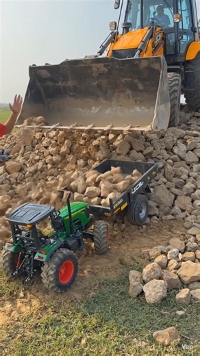 A Large Jcb Is Loading Stones Into A Small Tractor Convoy #reels #automobile #experiements #shorts