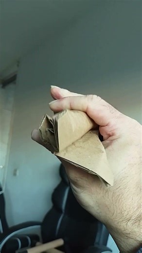 Crushing pieces of cardboard with 1 hand