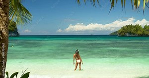 Beach peace sign, tropical and back of woman relax, paradise and outdoor wellness on island vacation holiday. Emoji V sign, sea waves and bikini girl on ocean adventure, nature or Bahamas travel trip
