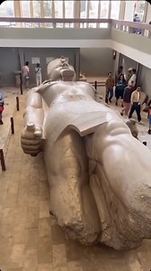 The massive statue of Ramesses II at Memphis, Egypt is a breathtaking artifact from ancient history. Carved from limestone , it originally towered over 10 meters in height , portraying the great pharaoh in a commanding pose . Discovered in 1820 near the ruins of the ancient capital , the statue symbolizes the splendor of Ramesses II’s reign, one of the most celebrated rulers of the New Kingdom . Though it now rests horizontally due to damage over the centuries , its intricate details, including 
