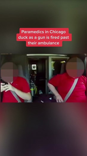 An individual can be seen leaning from a #car window brandishing a pistol. The #ambulance crew duck as they say ‘at least five shots’ can be heard