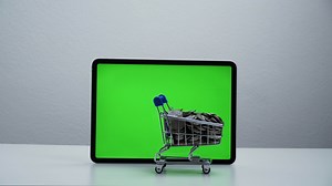 Download stop motion a cart shopping moving around tablet green screen. for free