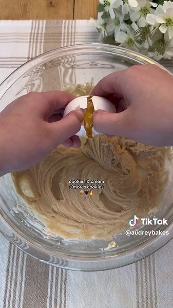 Cookies & Cream S’mores Cookies 🖤🤍 (recipe makes ~12-14 cookies) Ingredients: ½ cup (113g) unsalted butter, room temp 2 oz (57g) cream cheese, room temp ¾ cup (150g) brown sugar, packed ¼ cup (50g) granulated sugar 1 egg 1 egg yolk 2 tsp vanilla extract 2 cups (250g) all-purpose flour 1 tbsp cornstarch ½ tsp baking soda ½ tsp salt ~10 Oreos, roughly chopped ( some more for topping) ~½ cup chocolate chips Chocolate graham crackers Hersheys cookies & cream chocolate Regular Marshmallows optional